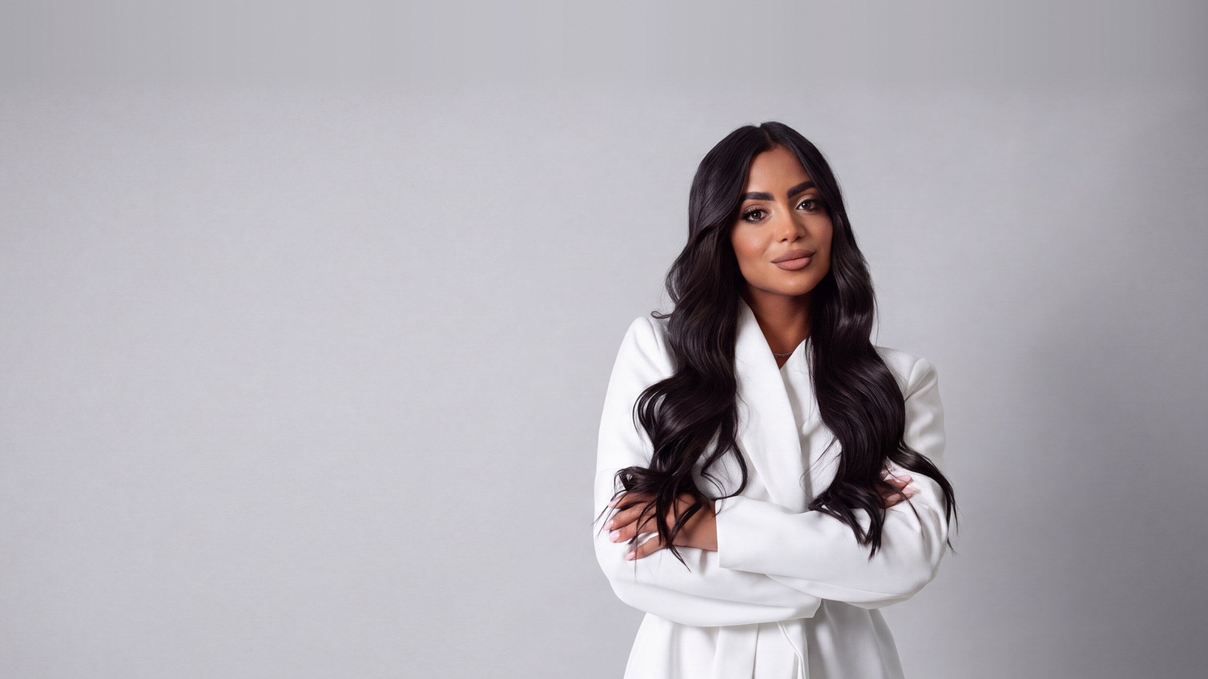 Samarys Rivera, founder of PIOSA, in a white suit